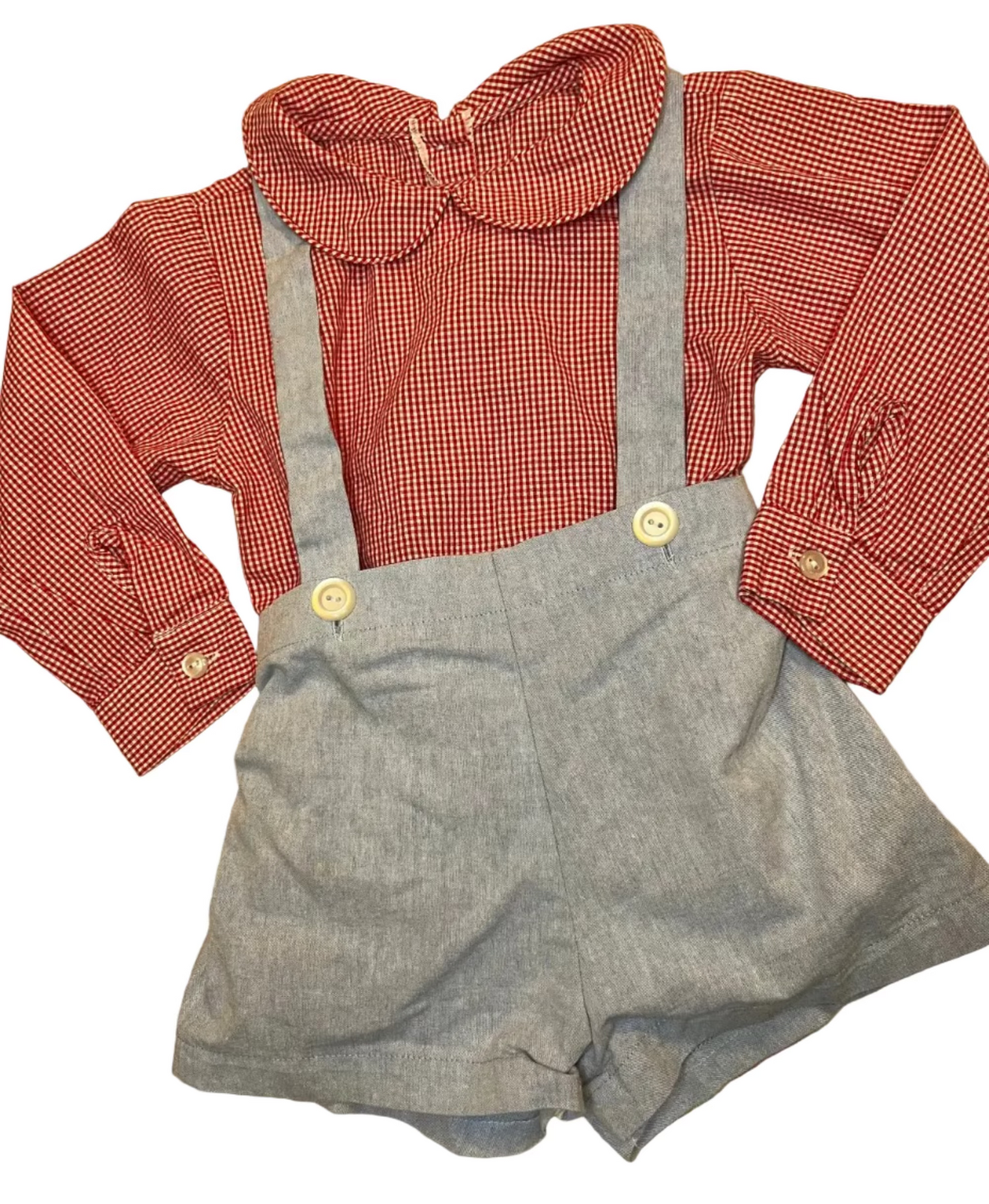Classic children's outfit with red gingham long sleeve blouse and grey suspender shorts