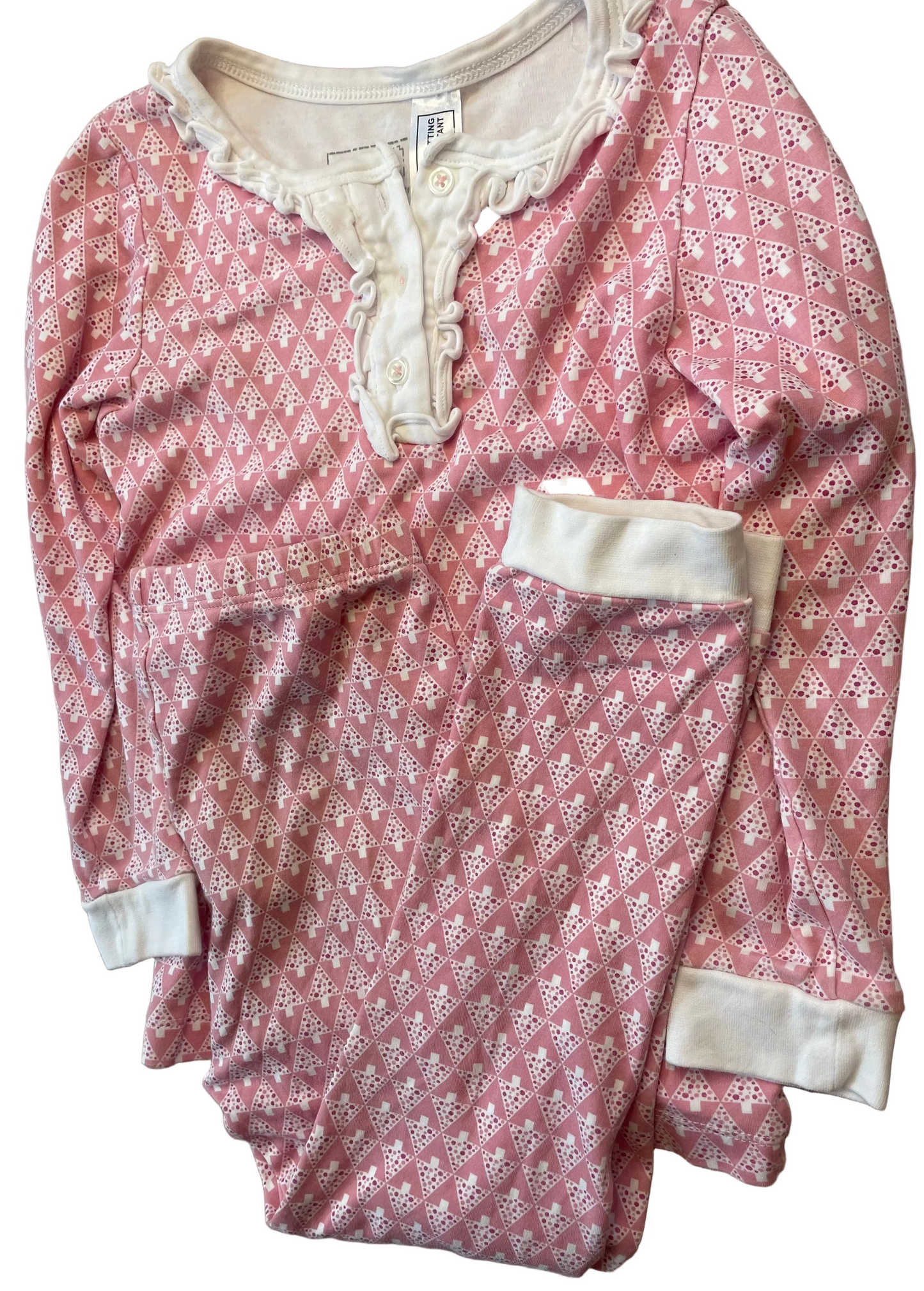 Pink and white patterned long sleeve children's pajama set with ruffle trim and cuffs