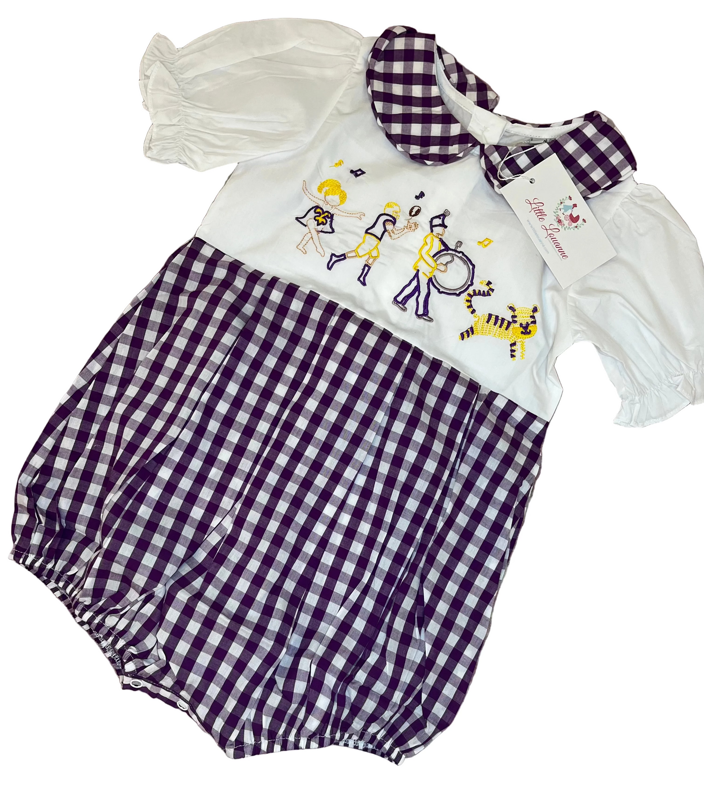 Purple gingham toddler romper with embroidered parade scene, puff sleeves, and Peter Pan collar