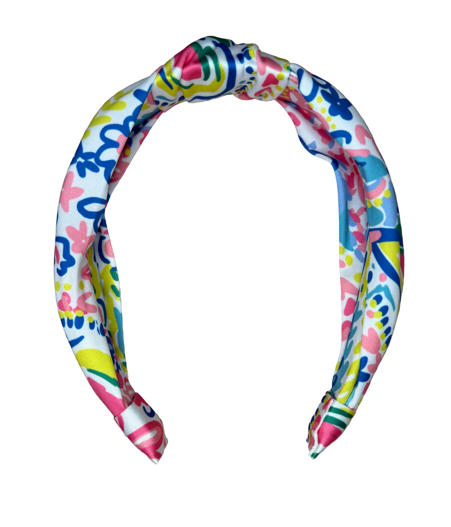 Colorful floral print children's headband with twisted top on white background