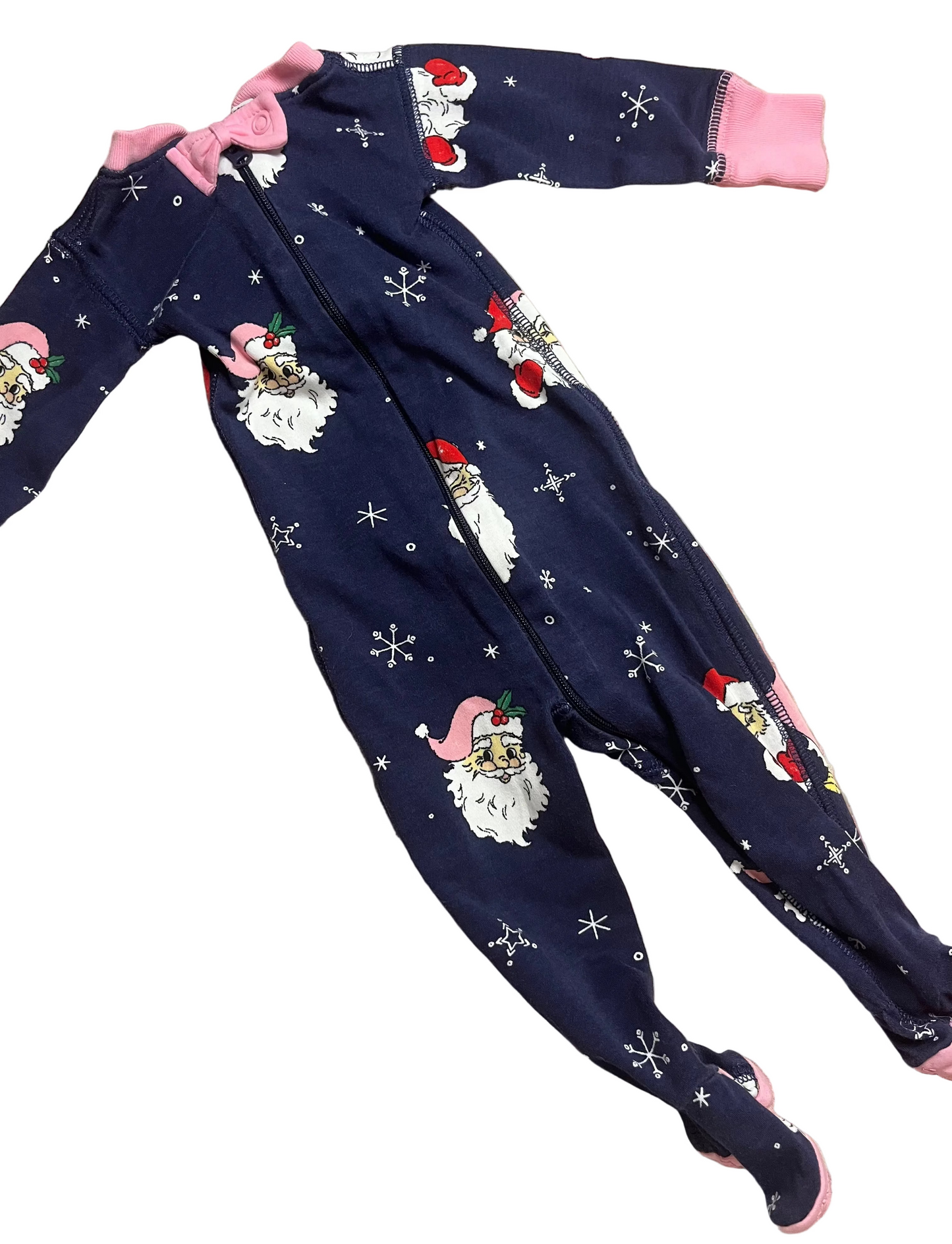Navy blue Santa-themed baby footed pajamas with pink trim and snowflake pattern