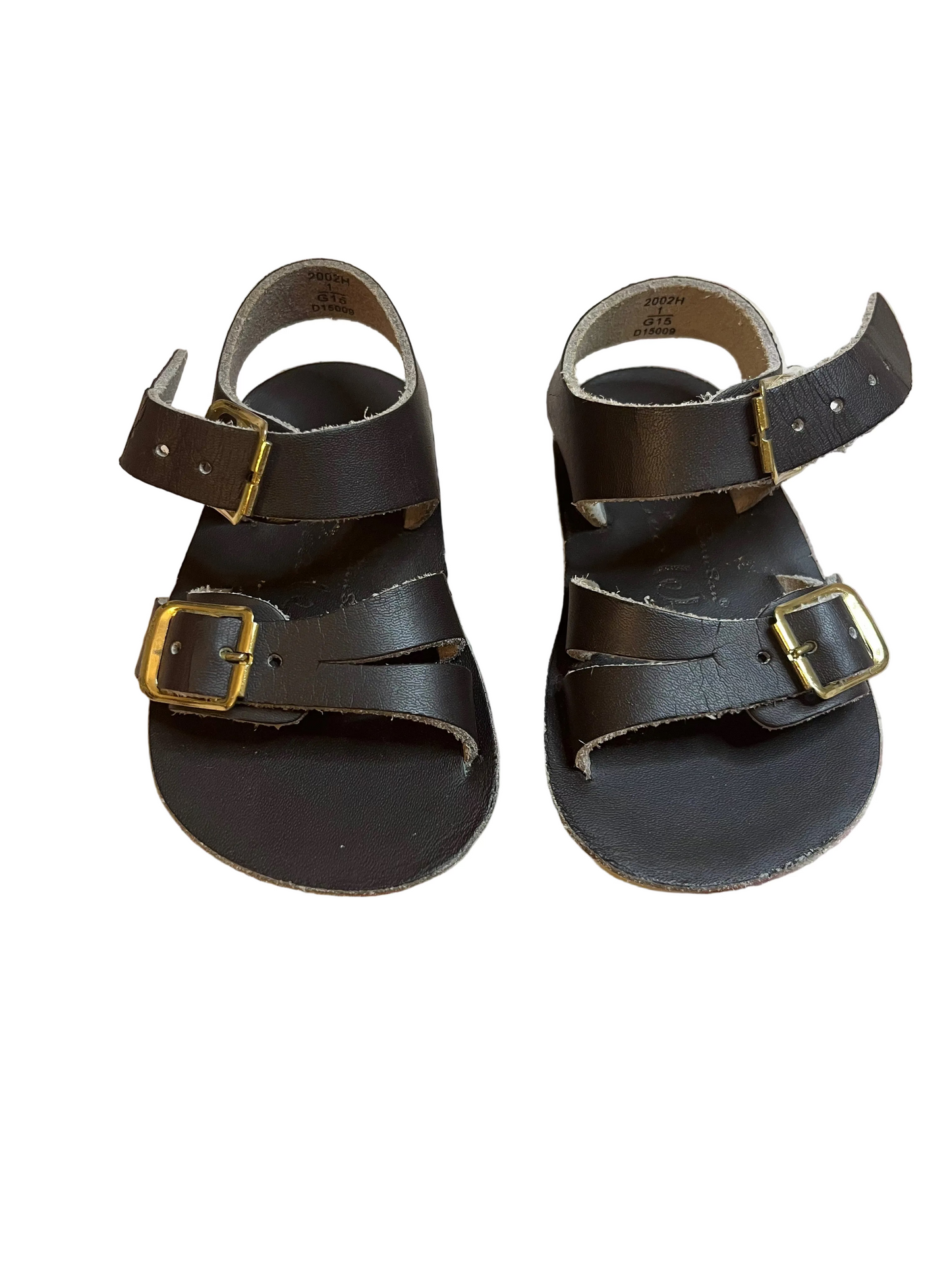 Classic brown leather children’s sandals with ankle straps and gold buckles on white background
