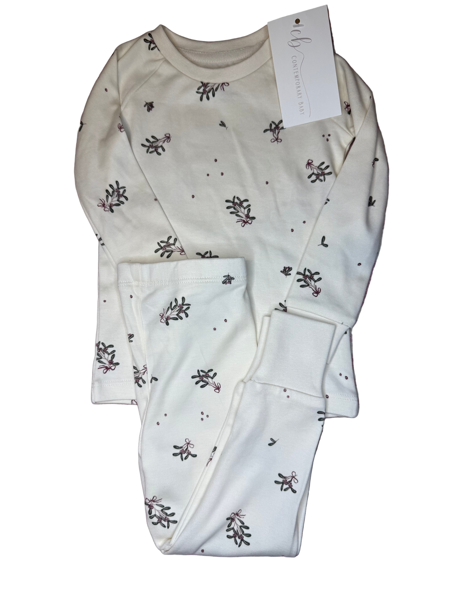 White children's pajama set with green and pink floral print, long sleeves, and matching pants