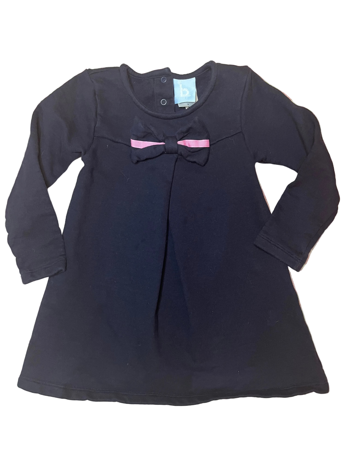 Long sleeve navy girls dress with pink bow, classic children's clothing flat lay