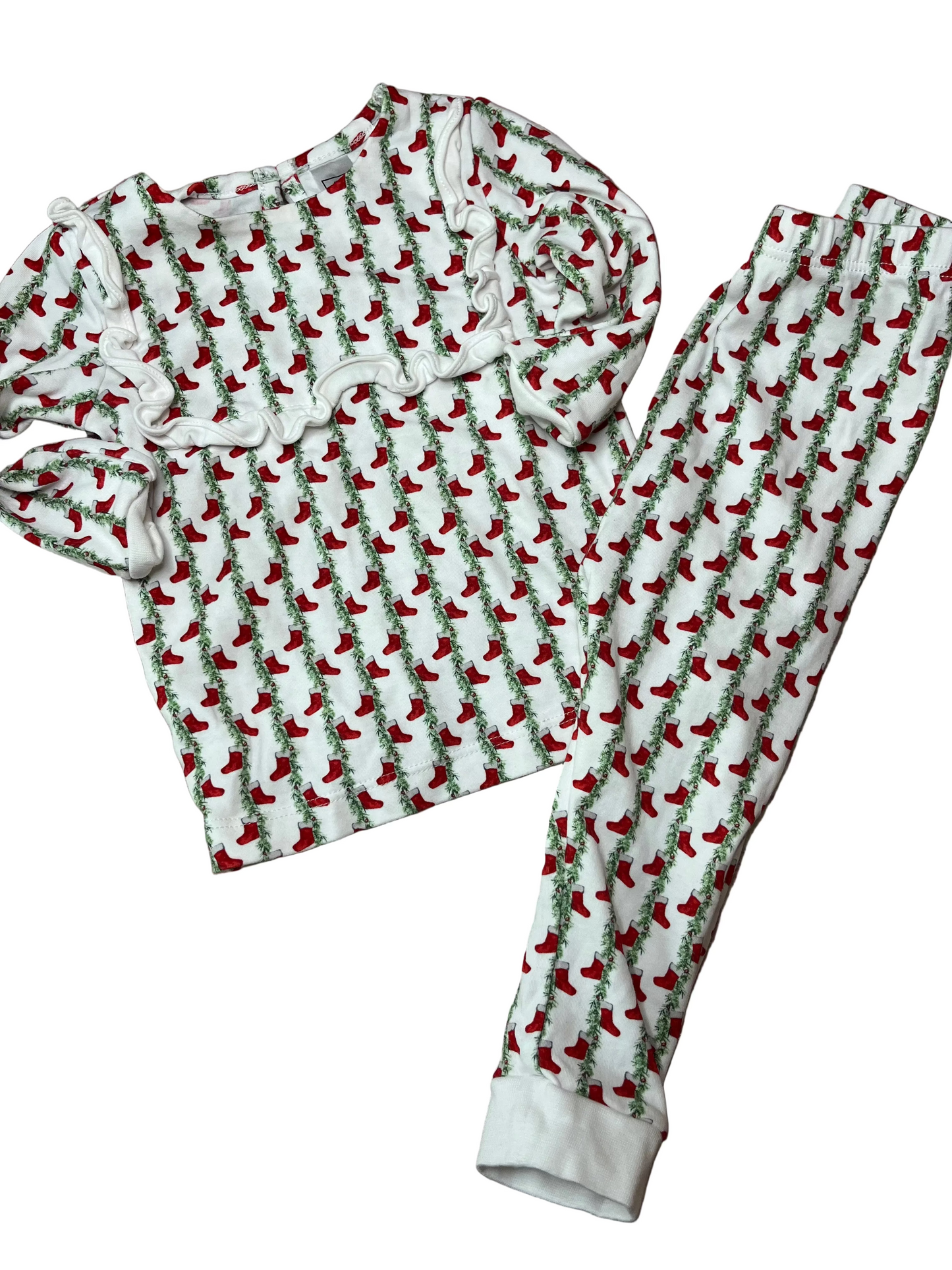 Children's Christmas pajamas set with red stocking print and ruffle detail, long sleeves, and pants.