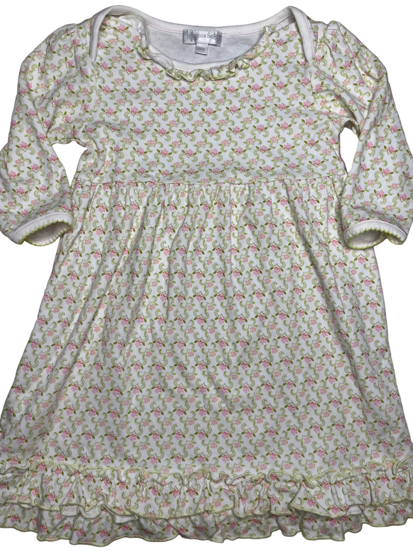 Long sleeve baby dress with pink and green floral pattern and ruffled hem