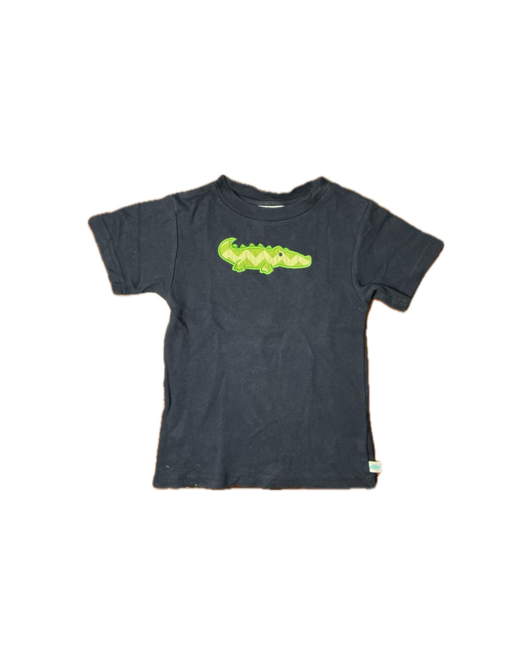 Navy blue children's t-shirt with green alligator applique on chest, short sleeves, casual style.