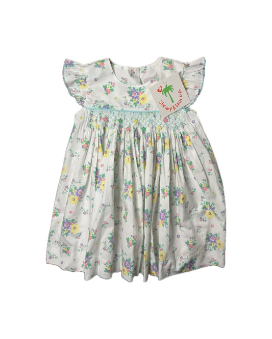 Floral smocked girls dress with flutter sleeves and multicolor flower print