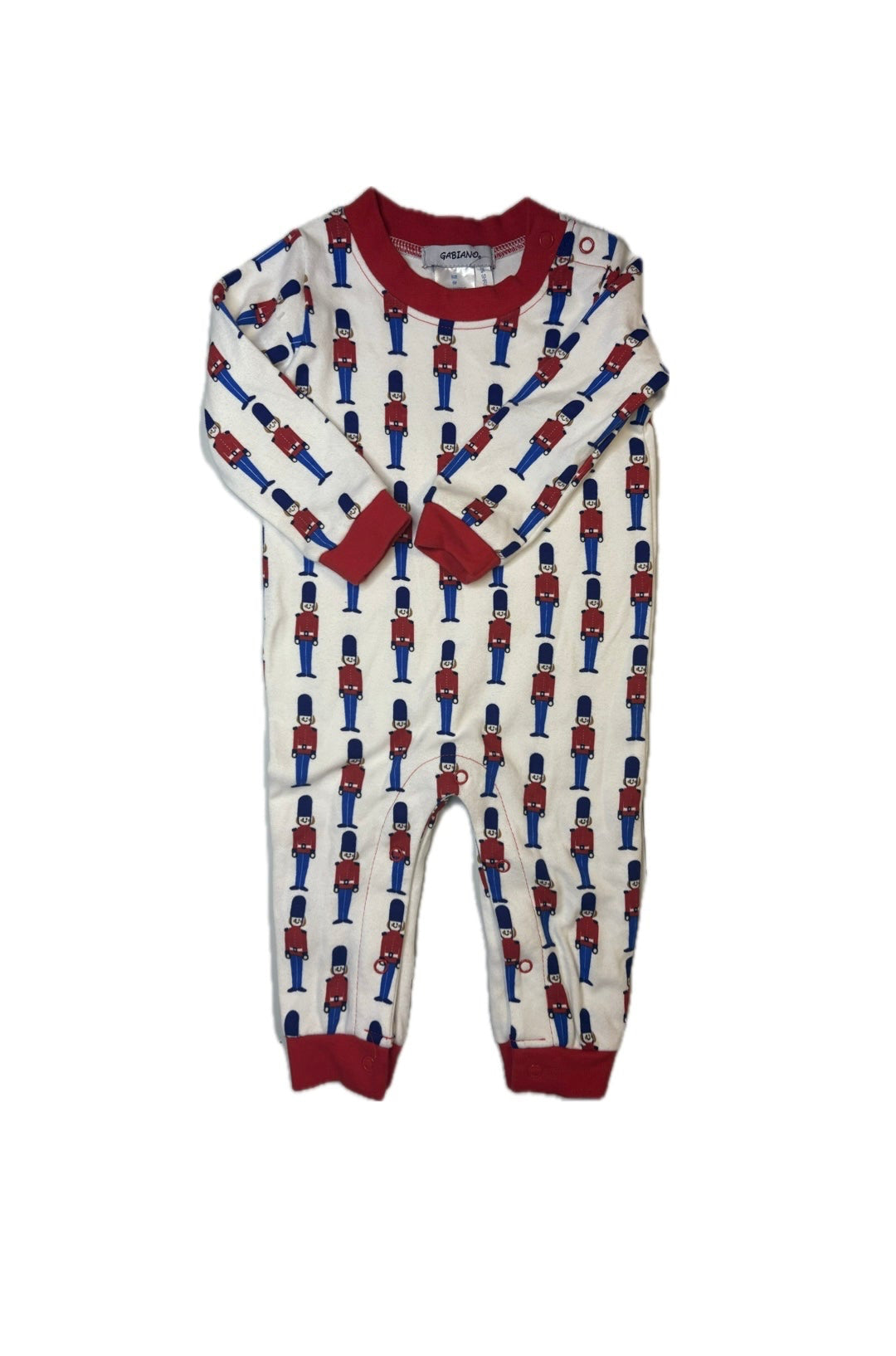 White baby romper with red and blue toy soldier print and red trim, long sleeves