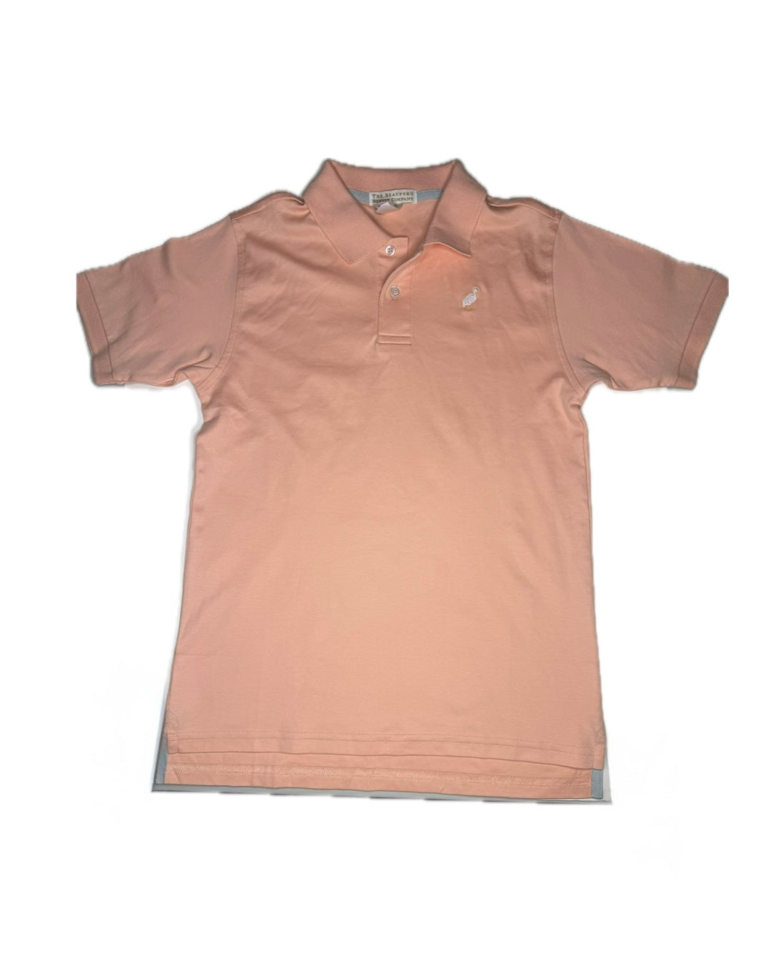 Peach short sleeve children's polo shirt with collar and embroidered logo, flat lay