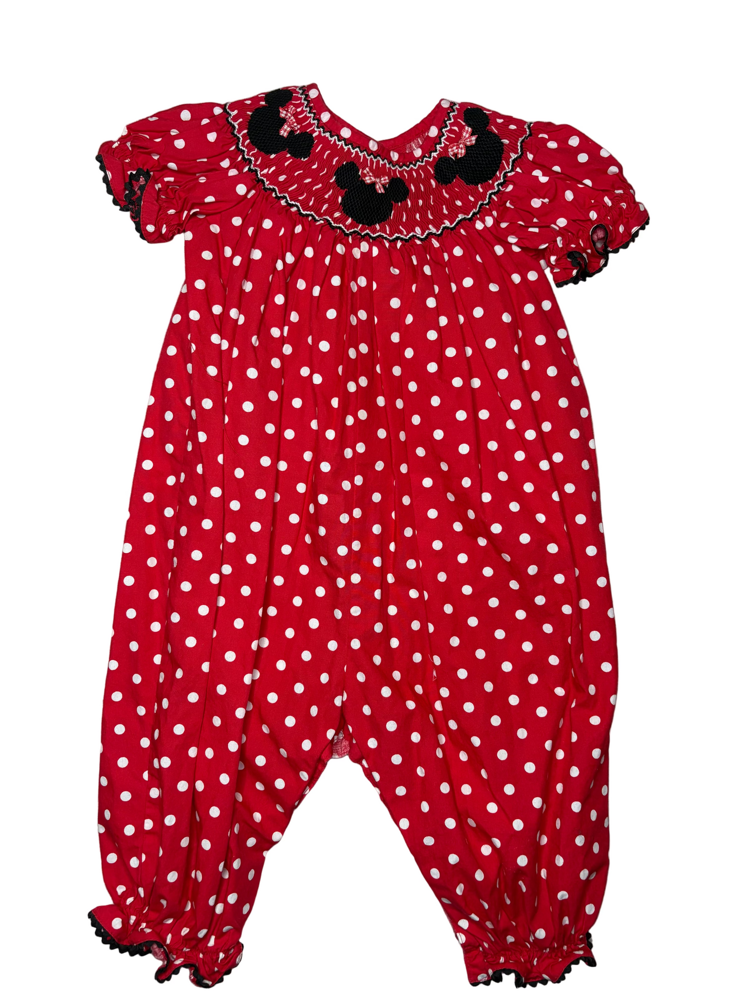 Red polka dot smocked children's romper with black mouse ear accents, short puff sleeves