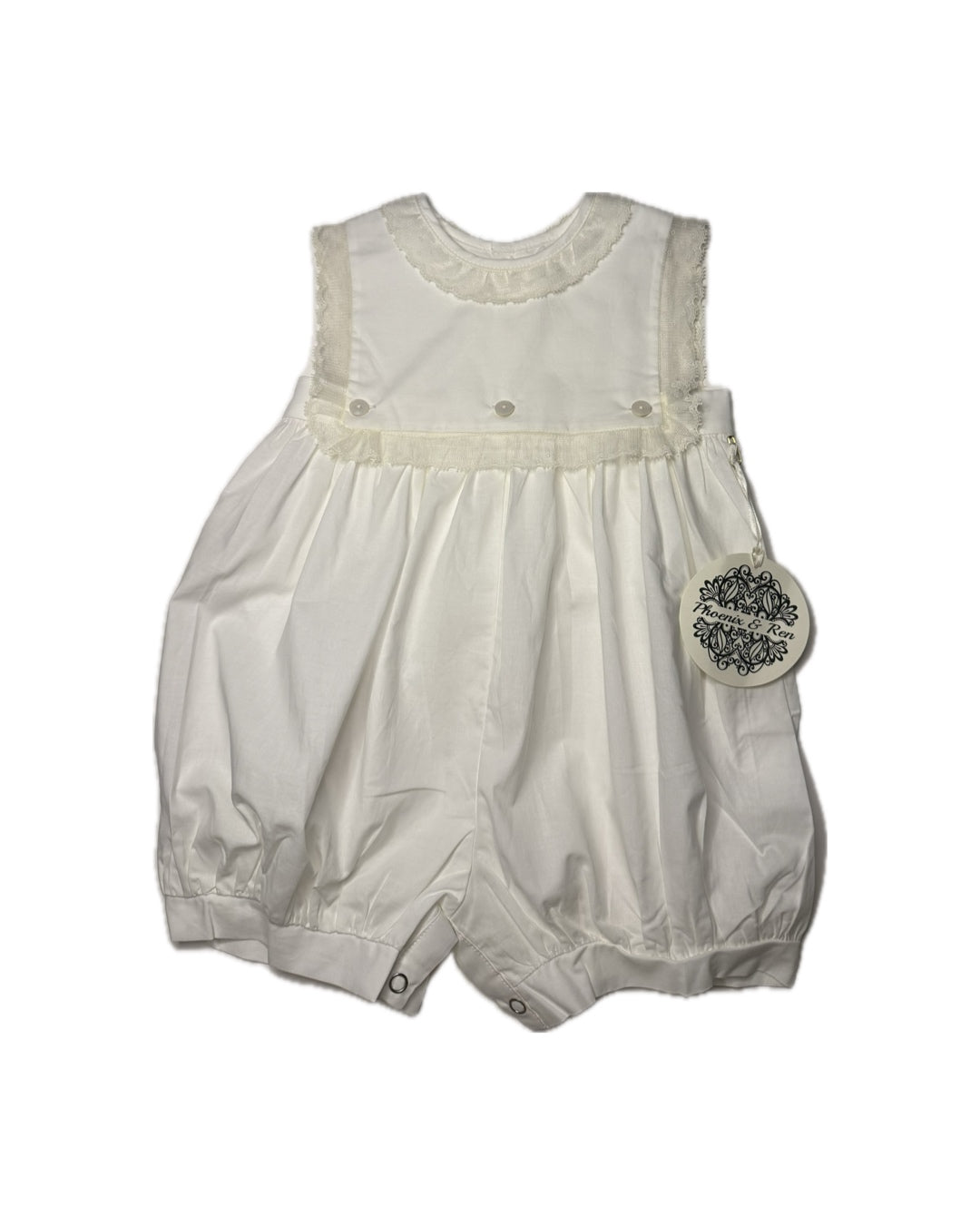 White sleeveless infant romper with lace trim and button details, suitable for special occasions.