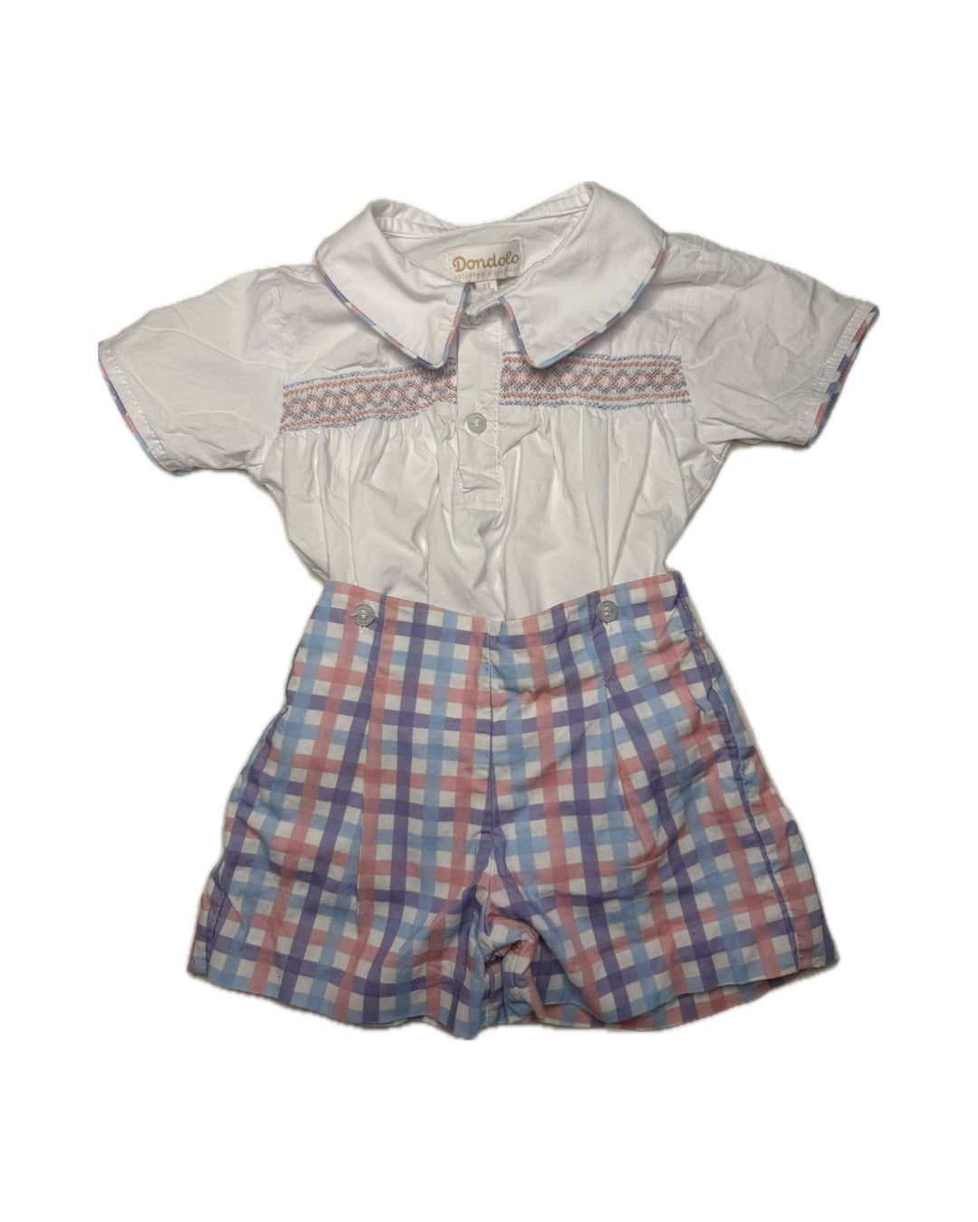 Children's outfit with checkered shorts and white shirt on a white background
