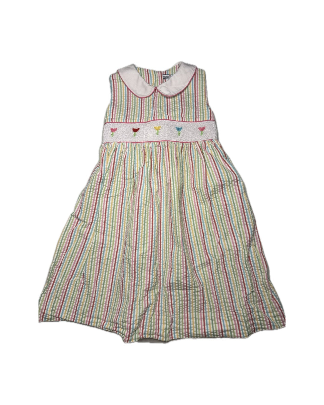 Striped dress with colorful trim on a white background