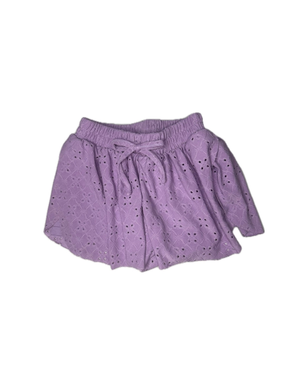 Purple skirt with eyelet details on a white background