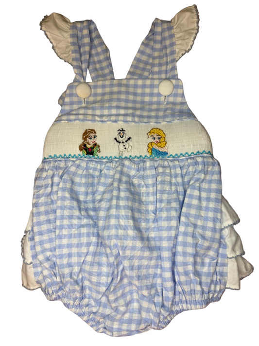 Blue and white checkered romper with Frozen Characters design on a patterned surface