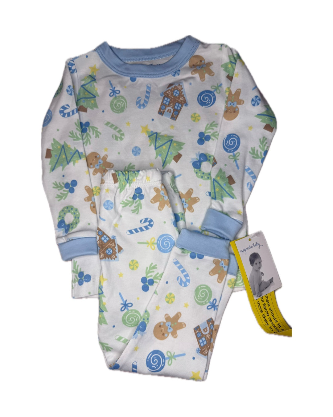 Children's holiday pajama set with Christmas trees, gingerbread men, and candy print